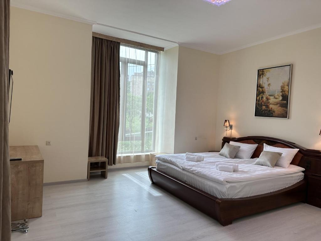 Postel nebo postele na pokoji v ubytování Hotel X