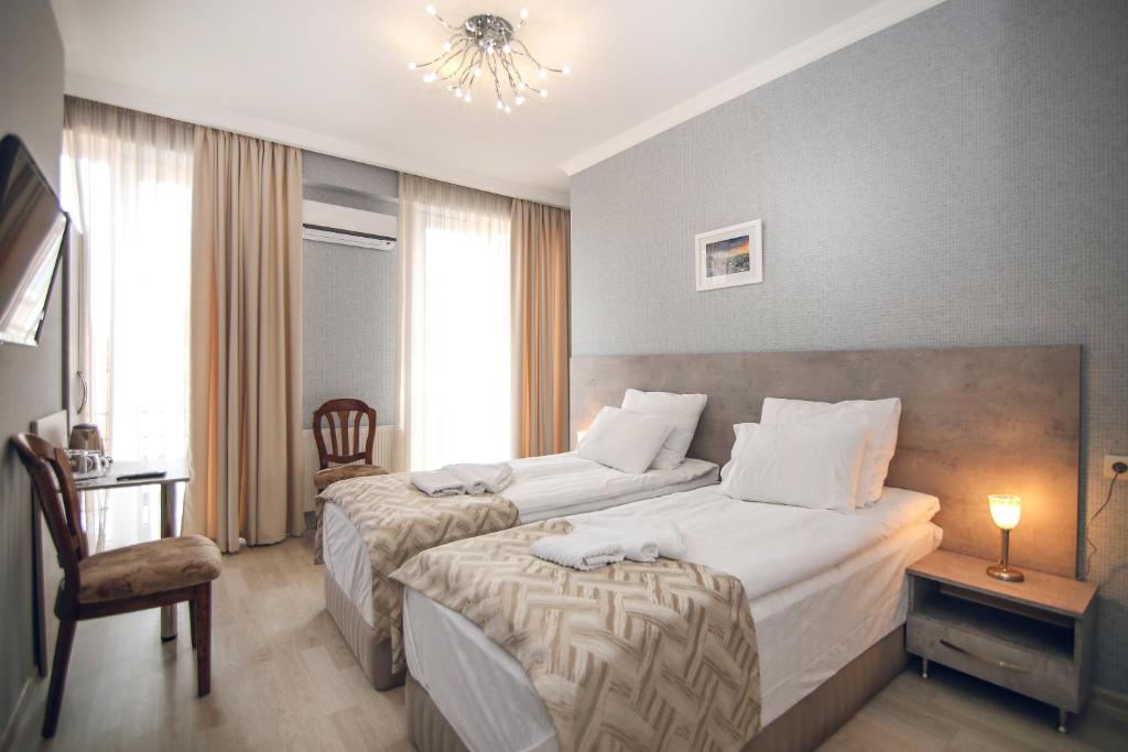 Postel nebo postele na pokoji v ubytování Hotel Kera