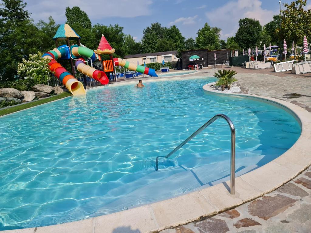 a large swimming pool with a water slide at LA VILLETTA DI MR MAX in Merone