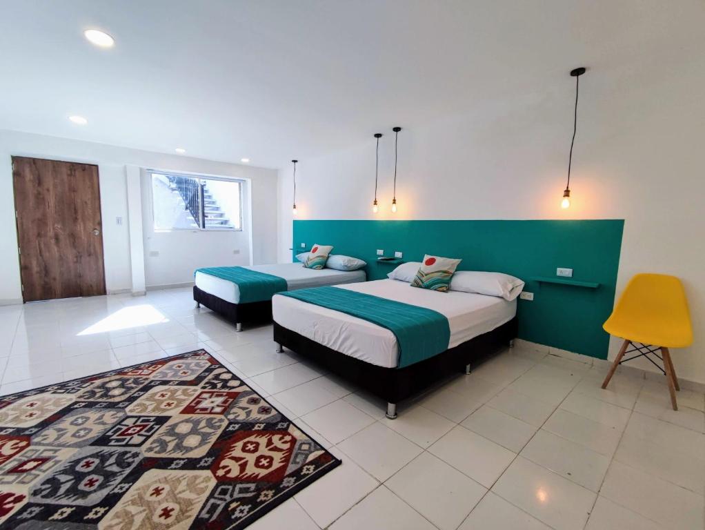 Cama o camas de una habitación en Bona Vida Hostel