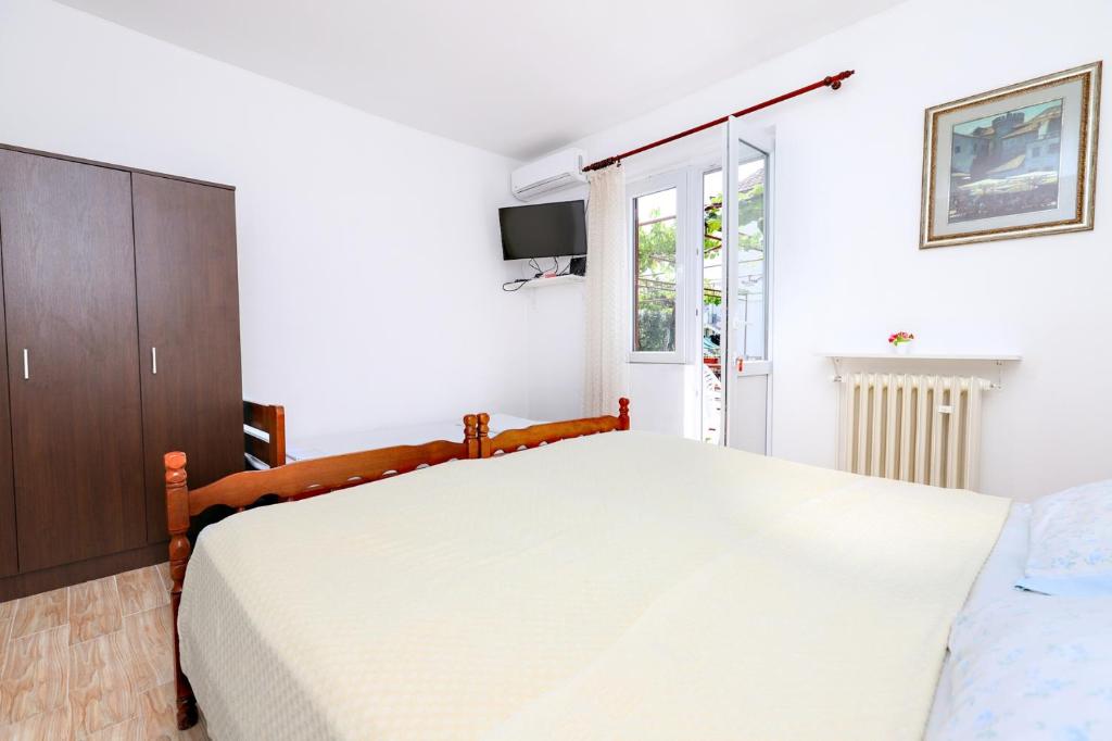 Postel nebo postele na pokoji v ubytování Apartmani i sobe Radojičić