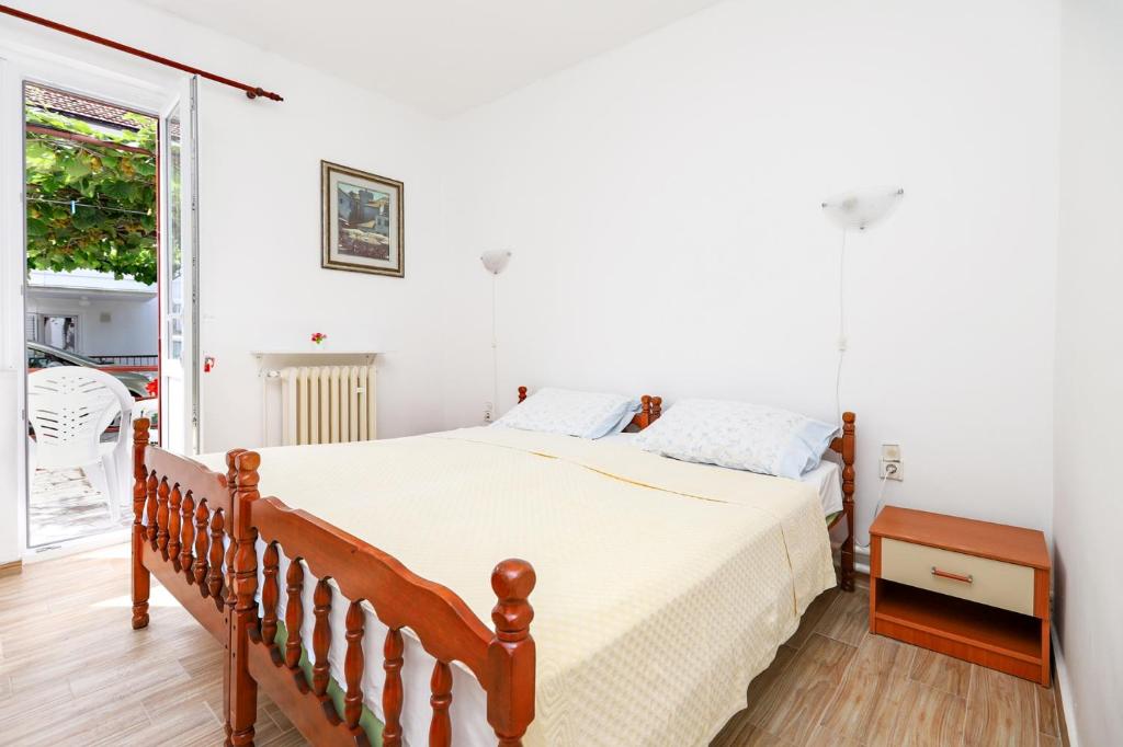 Postel nebo postele na pokoji v ubytování Apartmani i sobe Radojičić