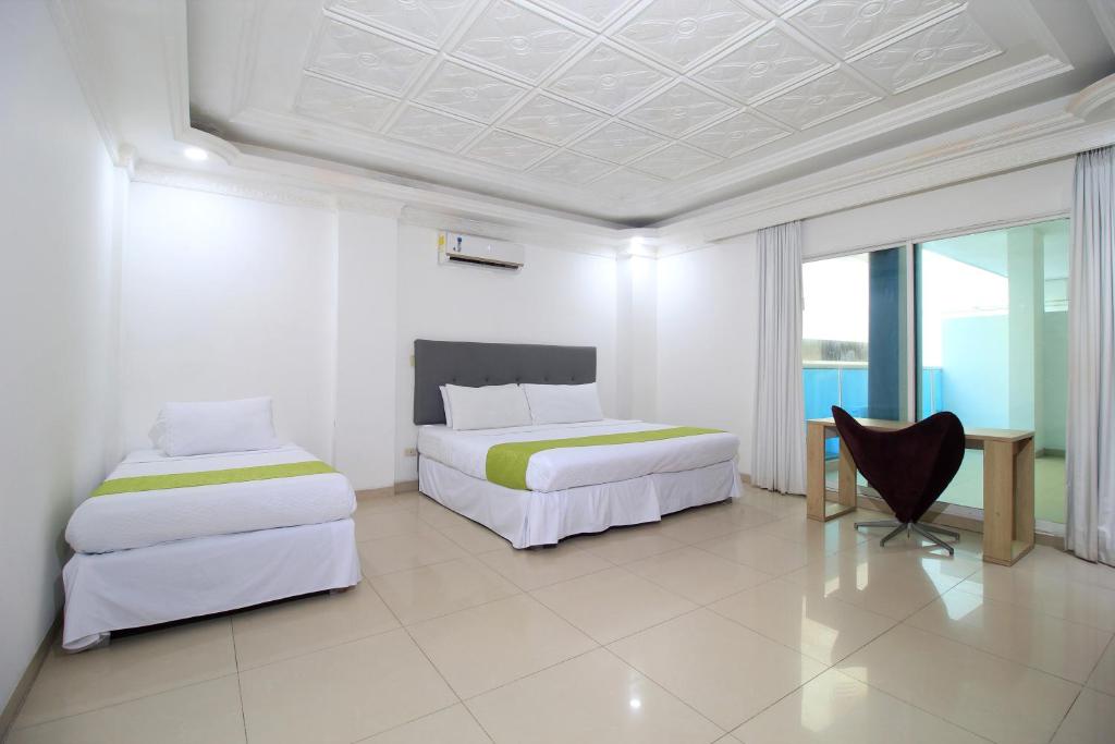 Uma cama ou camas num quarto em Hotel Abi Inn By GEH Suites