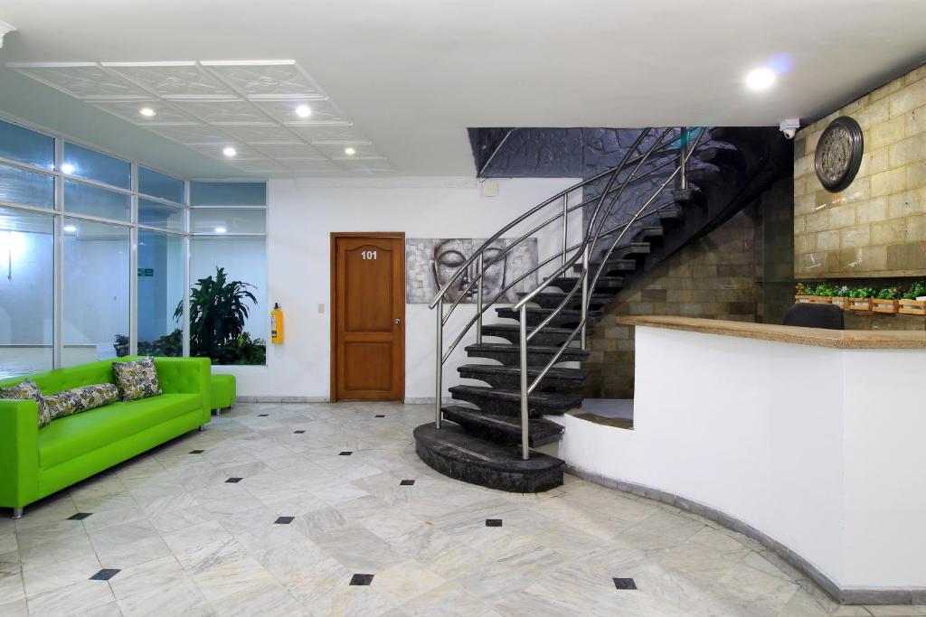 Uma área de estar em Hotel Abi Inn By GEH Suites