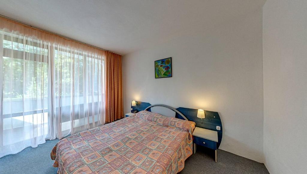 Postel nebo postele na pokoji v ubytování Elmar Hotel