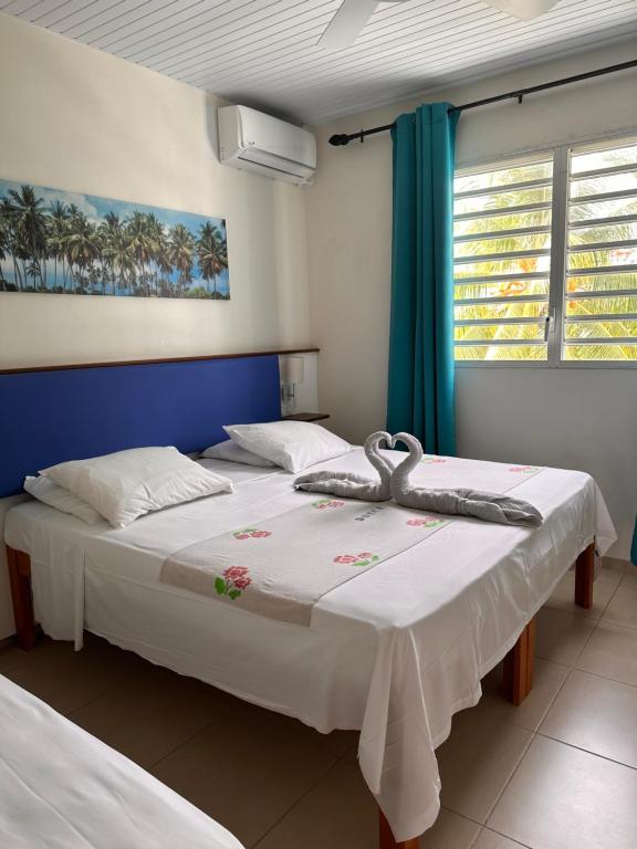 Postel nebo postele na pokoji v ubytování Hôtel DOUCE VAGUE