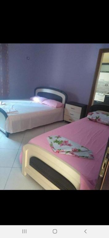 Postel nebo postele na pokoji v ubytování PARADISE VILLA