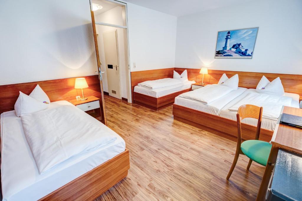Postel nebo postele na pokoji v ubytování Hotel Antares München