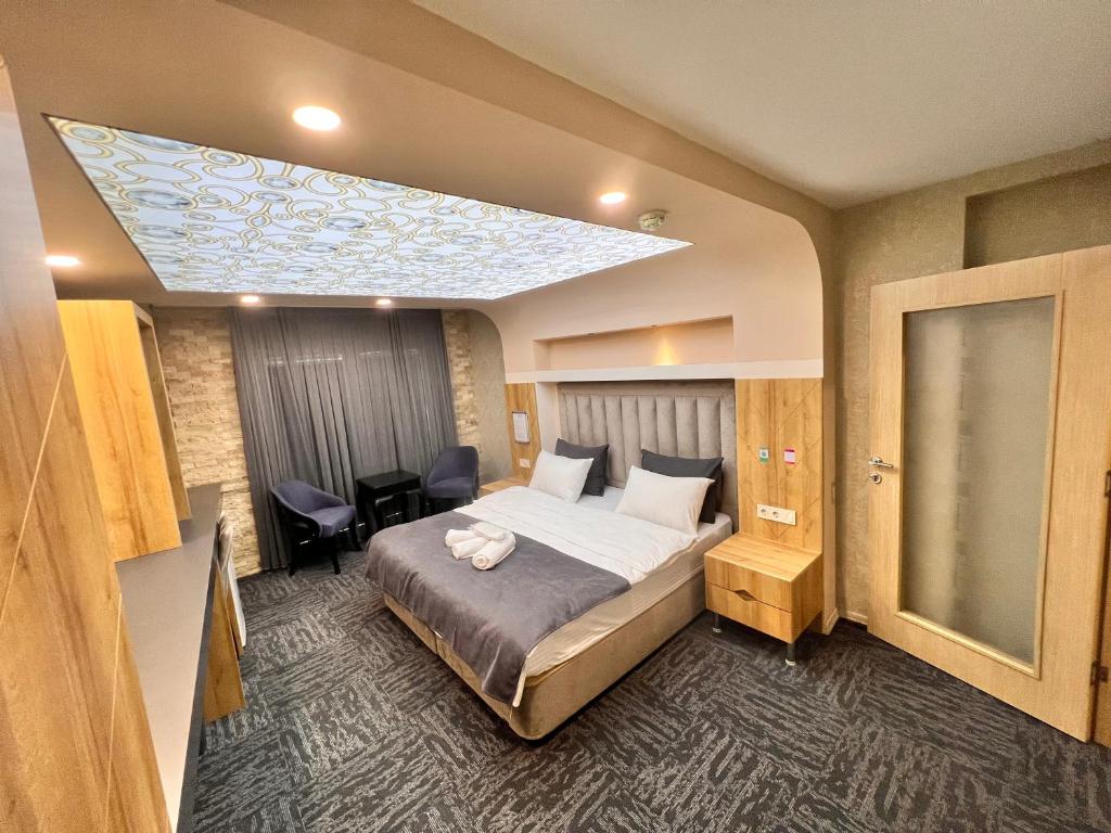a hotel room with a bed and a skylight at Fengo Hotel & Spa in Trabzon