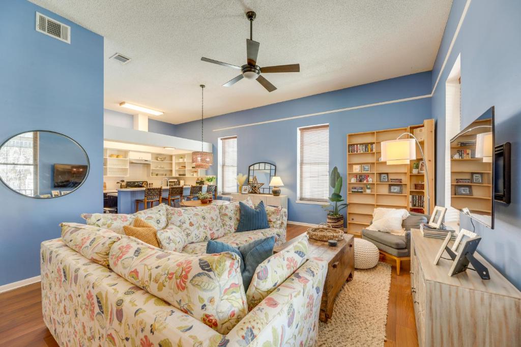 a living room with blue walls and a couch at Renovated San Marcos Vacation Rental with Balcony! in San Marcos