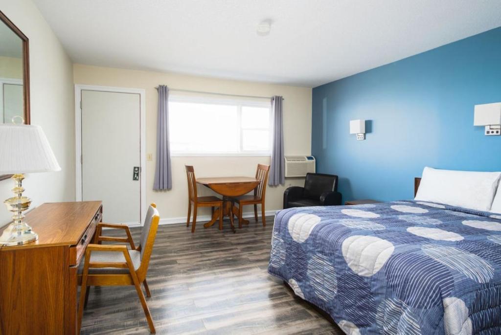 Postel nebo postele na pokoji v ubytování Hebridean Motel