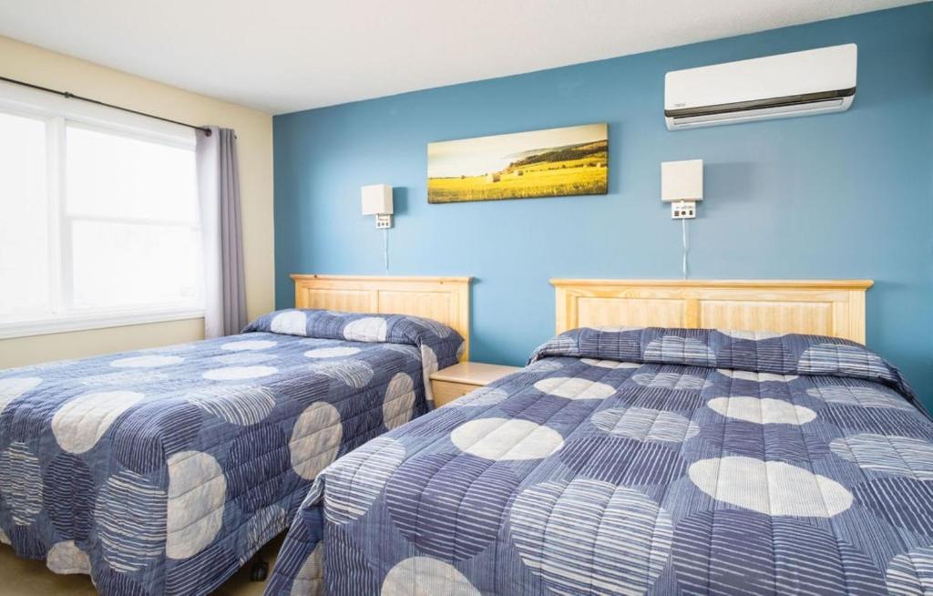 Postel nebo postele na pokoji v ubytování Hebridean Motel