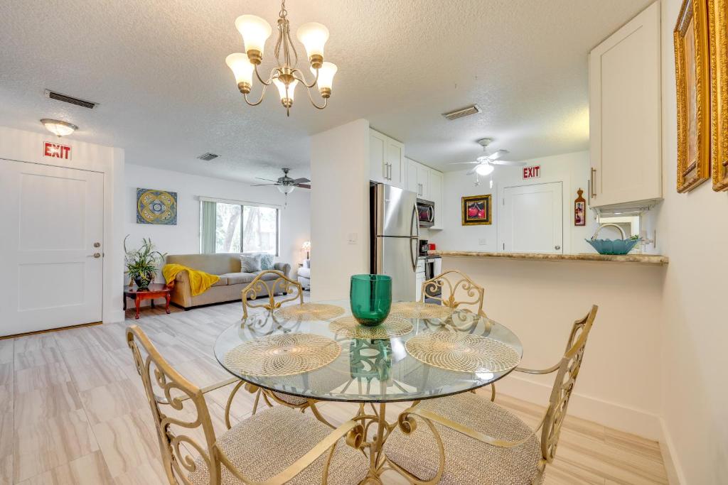 a dining room and kitchen with a glass table and chairs at Florida Vacation Rental Near Historic Downtown in Saint Augustine