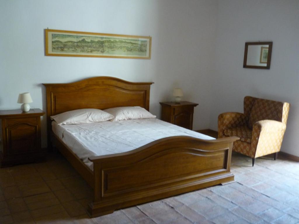 En eller flere senge i et værelse på Casa nella Fortezza