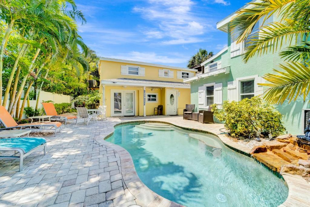 a swimming pool in front of a house at Casa Del Sol B in Bradenton Beach