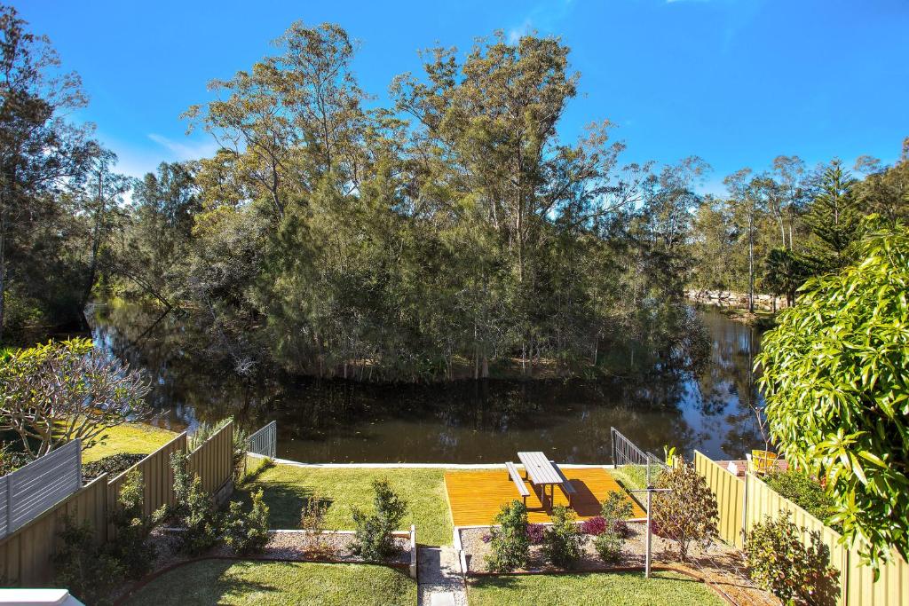 a view of a river from a yard at Renovated Coastal getaway with water views in Umina