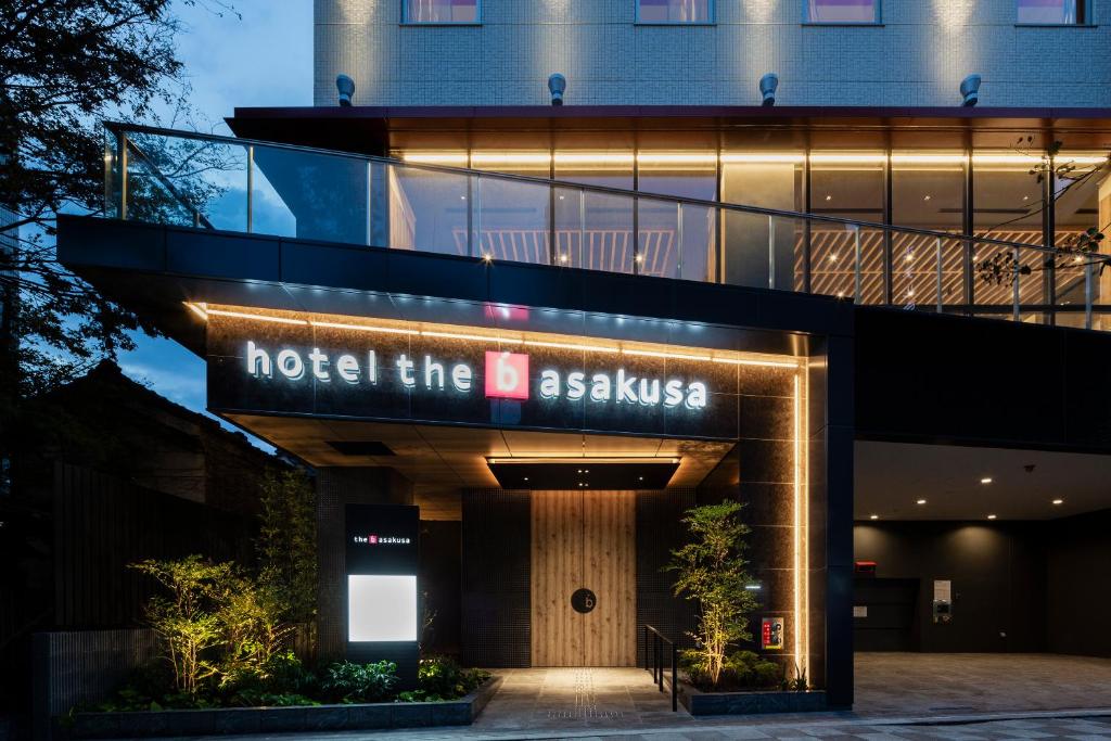 a building with a sign that reads hotel the ashkisskiss at the b asakusa in Tokyo