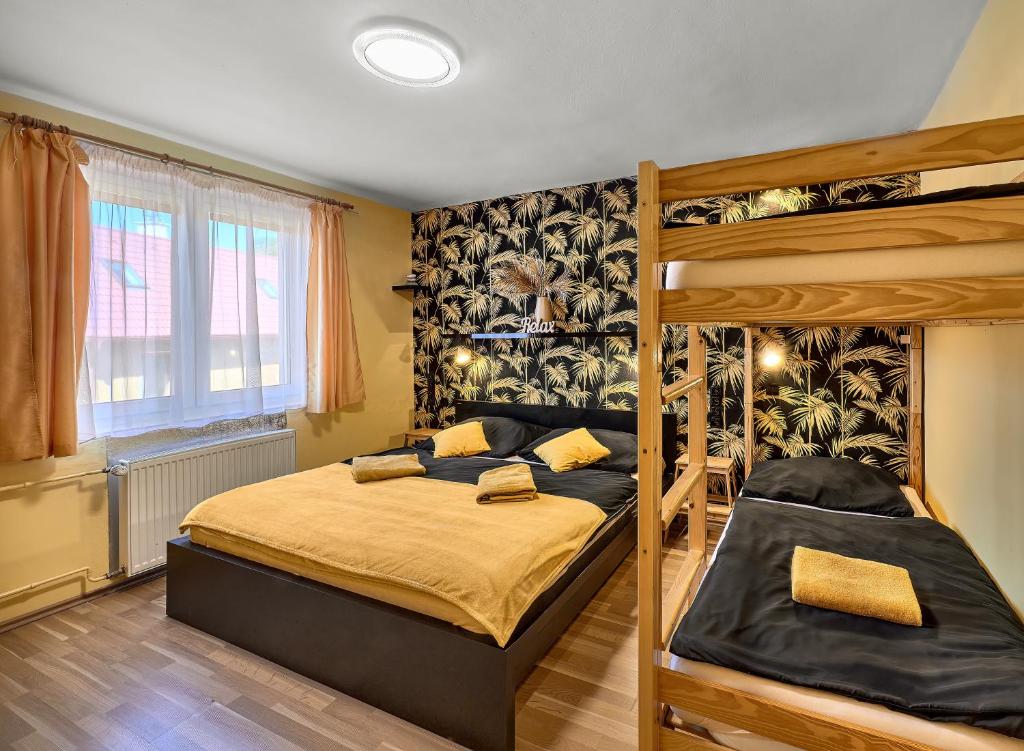 Postel nebo postele na pokoji v ubytování Penzion V Roklich & Apartmens V Roklich