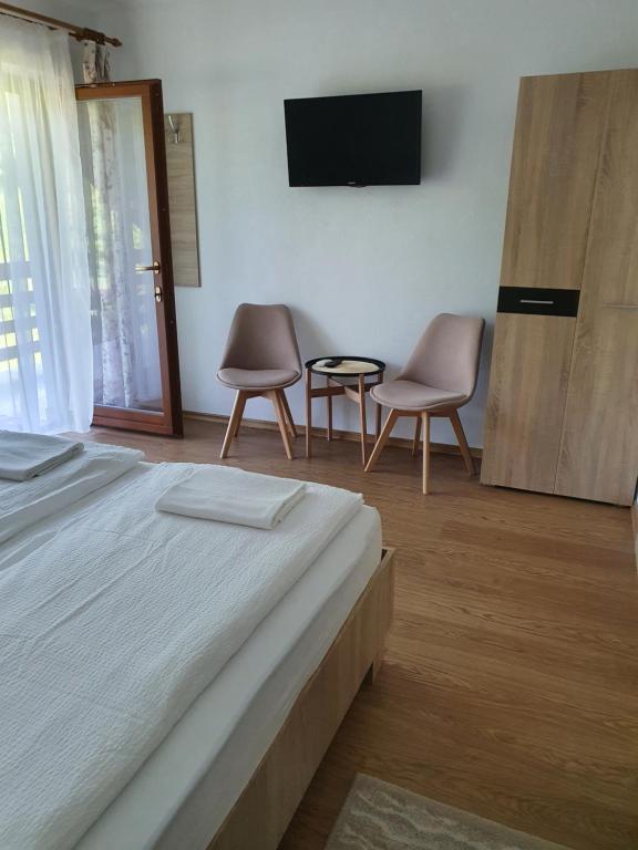 Postel nebo postele na pokoji v ubytování Casa Toth