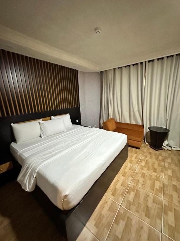 Postel nebo postele na pokoji v ubytování Msquare Hotel GRA