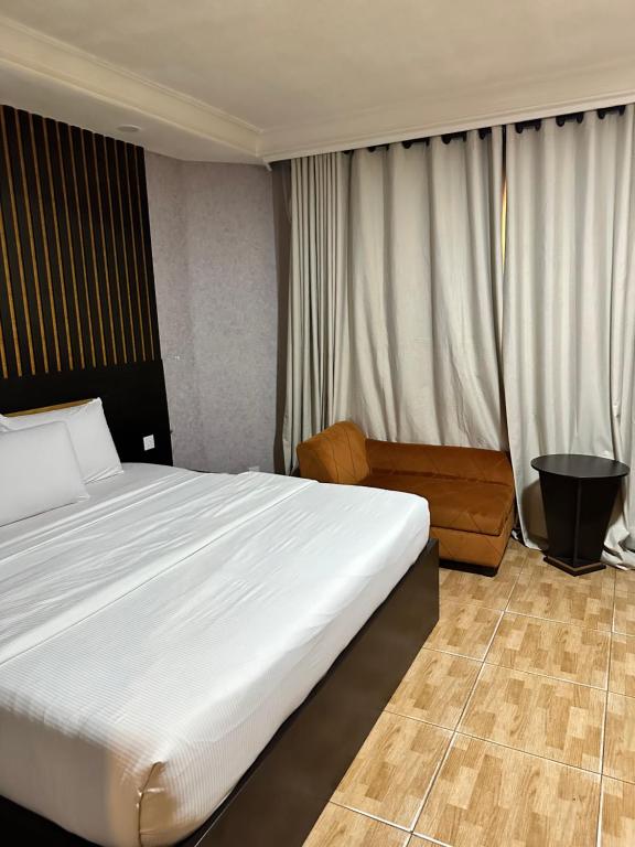 Postel nebo postele na pokoji v ubytování Msquare Hotel GRA
