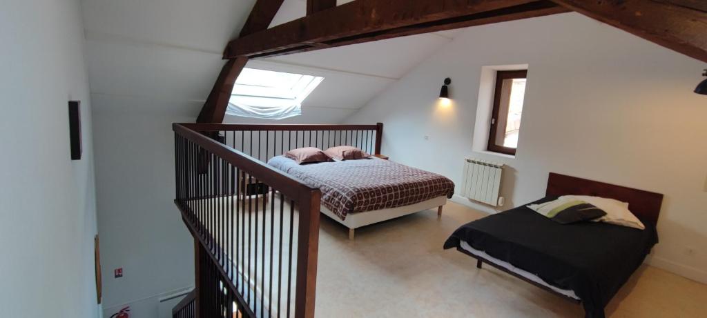 Postel nebo postele na pokoji v ubytování Gîte familial de la Bastide du puech