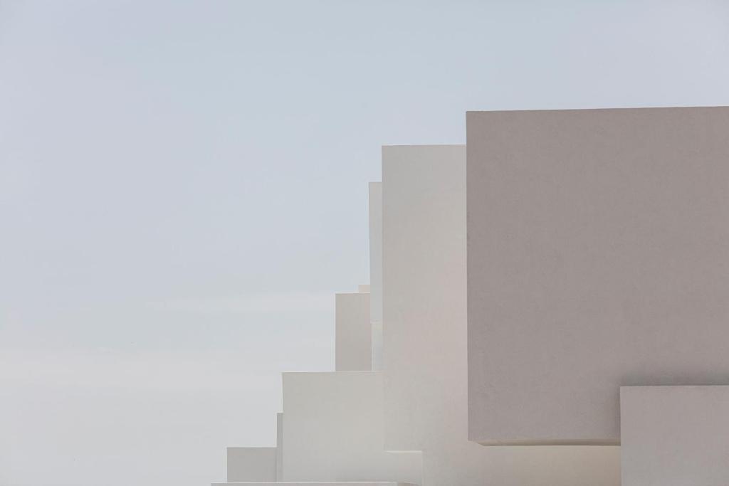 a view of a city skyline in the fog at Neo Suites in Fira