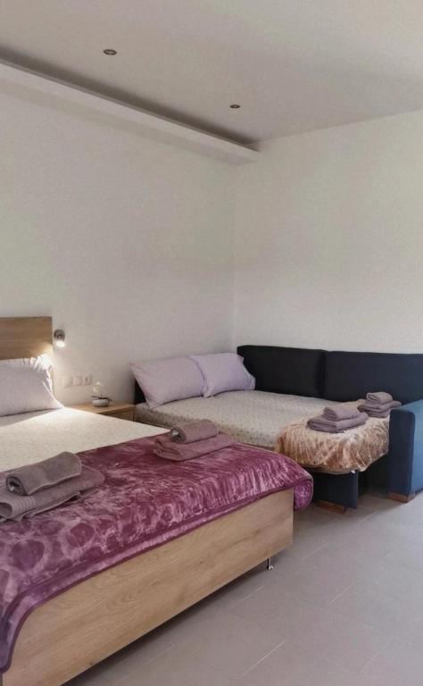 Postel nebo postele na pokoji v ubytování CASA QUERCU