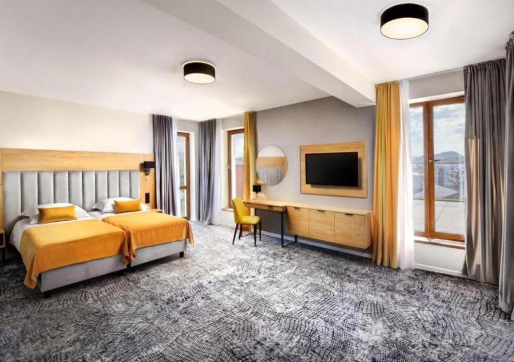 Postel nebo postele na pokoji v ubytování Hotel Akvamarín