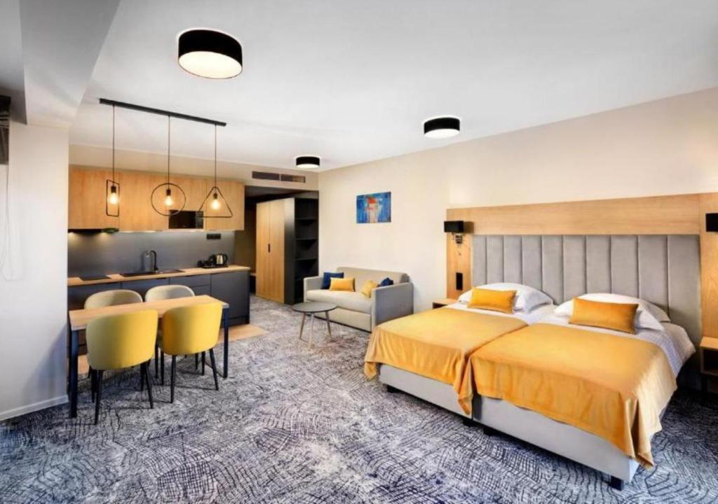 Postel nebo postele na pokoji v ubytování Hotel Akvamarín