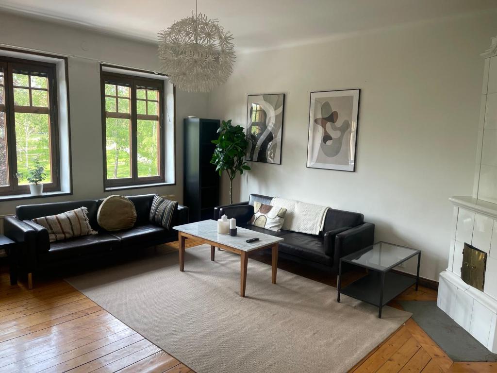 a living room with a couch and a coffee table at Apartment Garbo in Stockholm