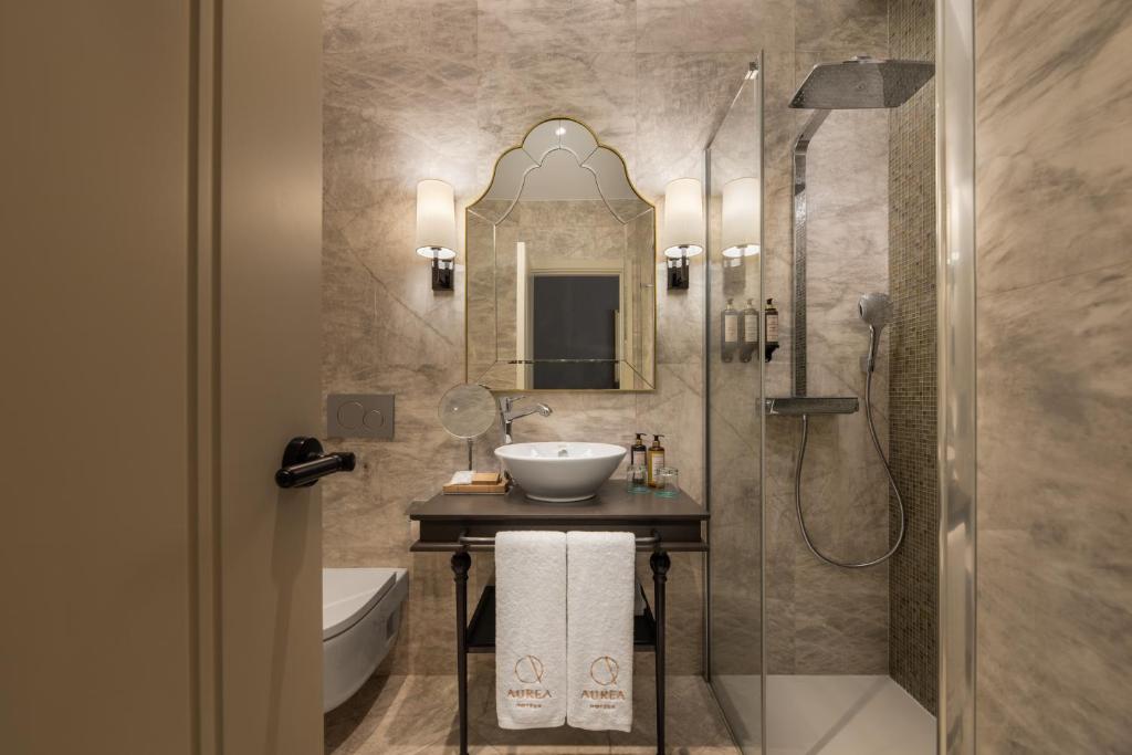 a bathroom with a sink and a shower at Áurea Casa Palacio Sagasta by Eurostars Hotel Company in Cádiz