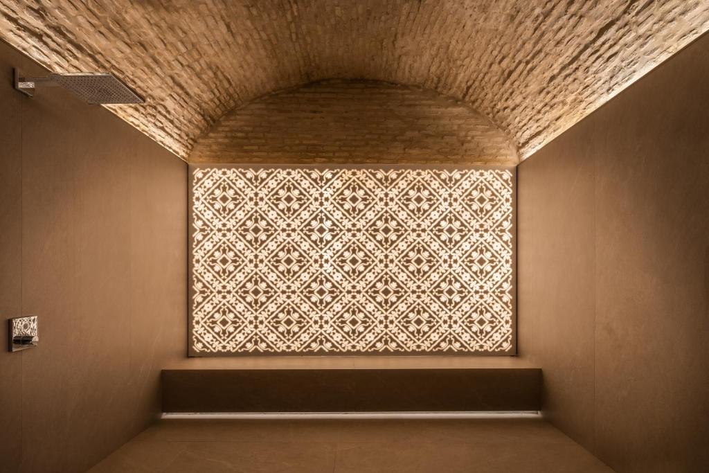 a window in a room with a patterned wall at Áurea Casa Palacio Sagasta by Eurostars Hotel Company in Cádiz