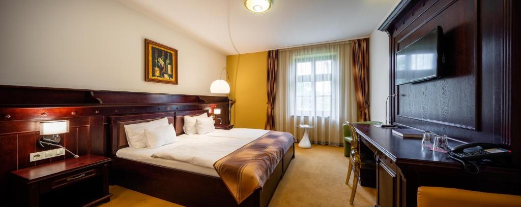 Postel nebo postele na pokoji v ubytování Hotel Vécsecity