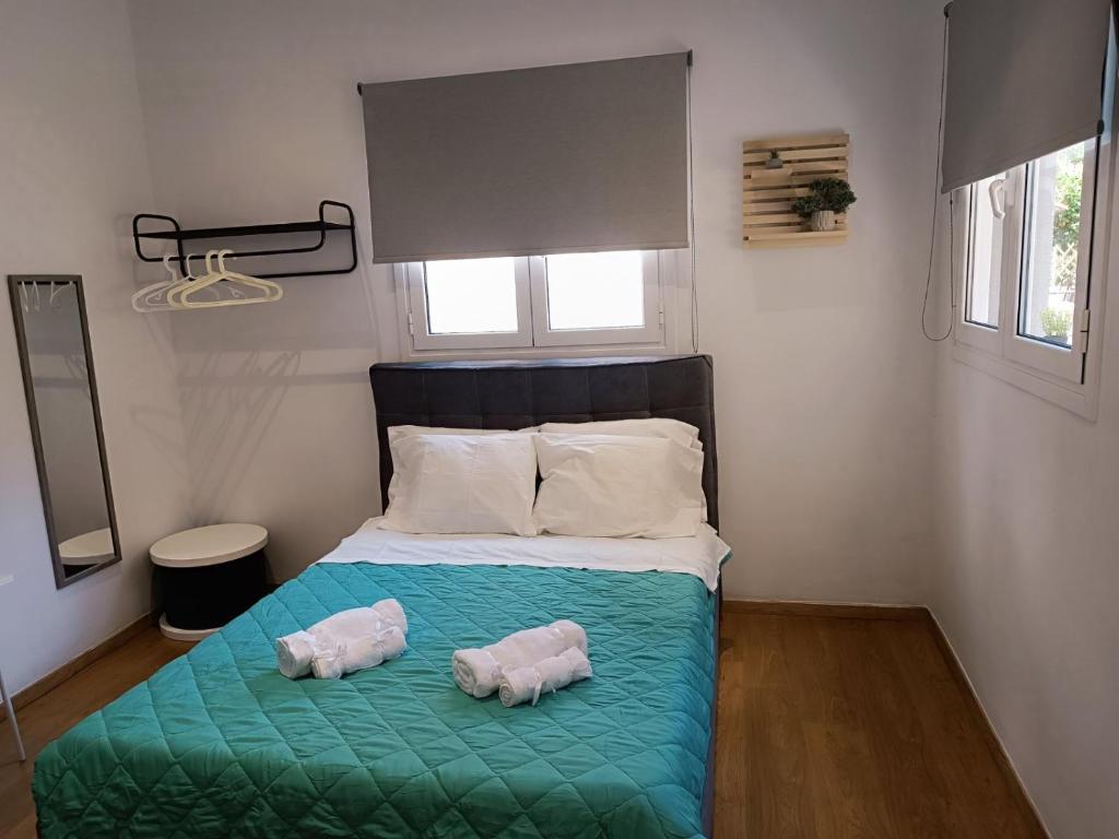 Postel nebo postele na pokoji v ubytování ZOIS APARTMENT