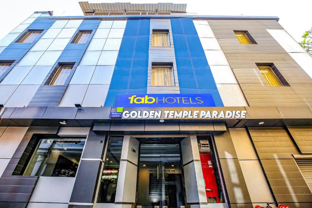 a building with a sign on the front of it at FabHotel Golden Temple Paradise in Amritsar