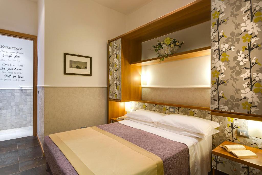 Postel nebo postele na pokoji v ubytování Hotel Marcantonio