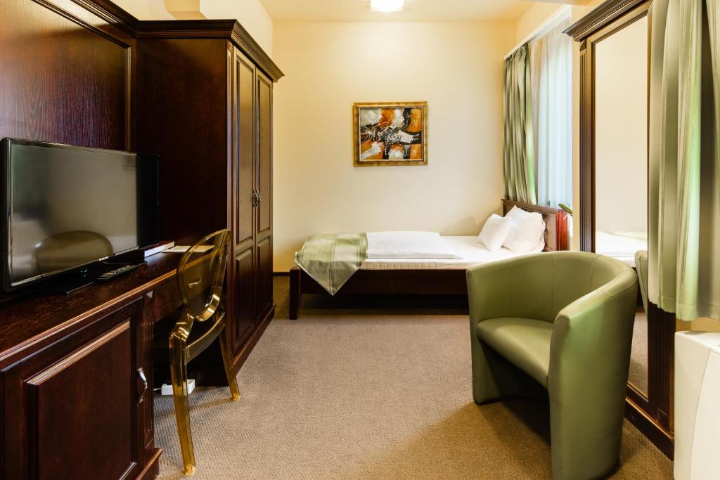 Postel nebo postele na pokoji v ubytování Hotel Vécsecity