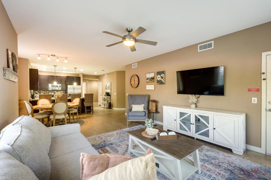 a living room with a couch and a tv at Pet-Friendly Phoenix Condo with Community Amenities in Phoenix