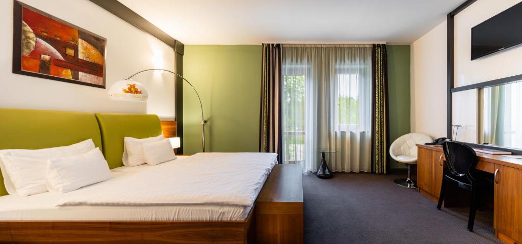 Postel nebo postele na pokoji v ubytování Hotel Vécsecity