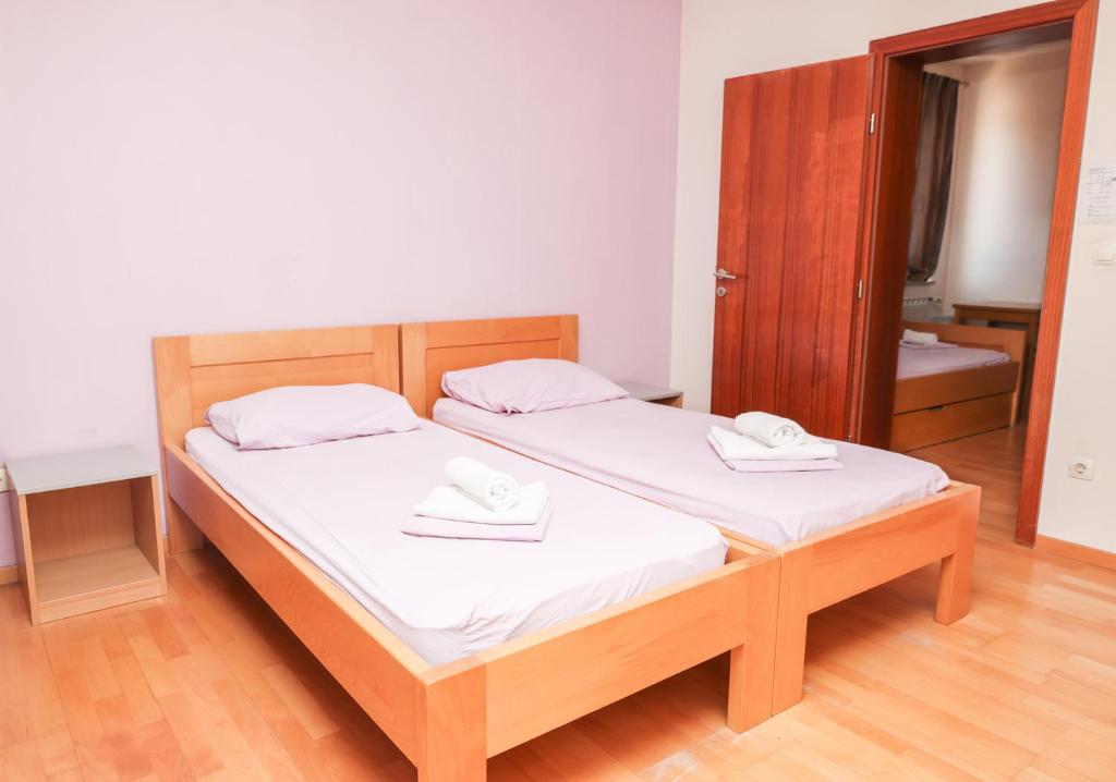 Una cama o camas en una habitación de HI Hostel Zadar