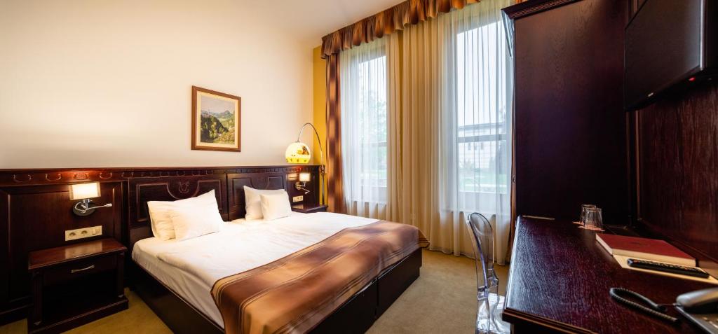 Postel nebo postele na pokoji v ubytování Hotel Vécsecity