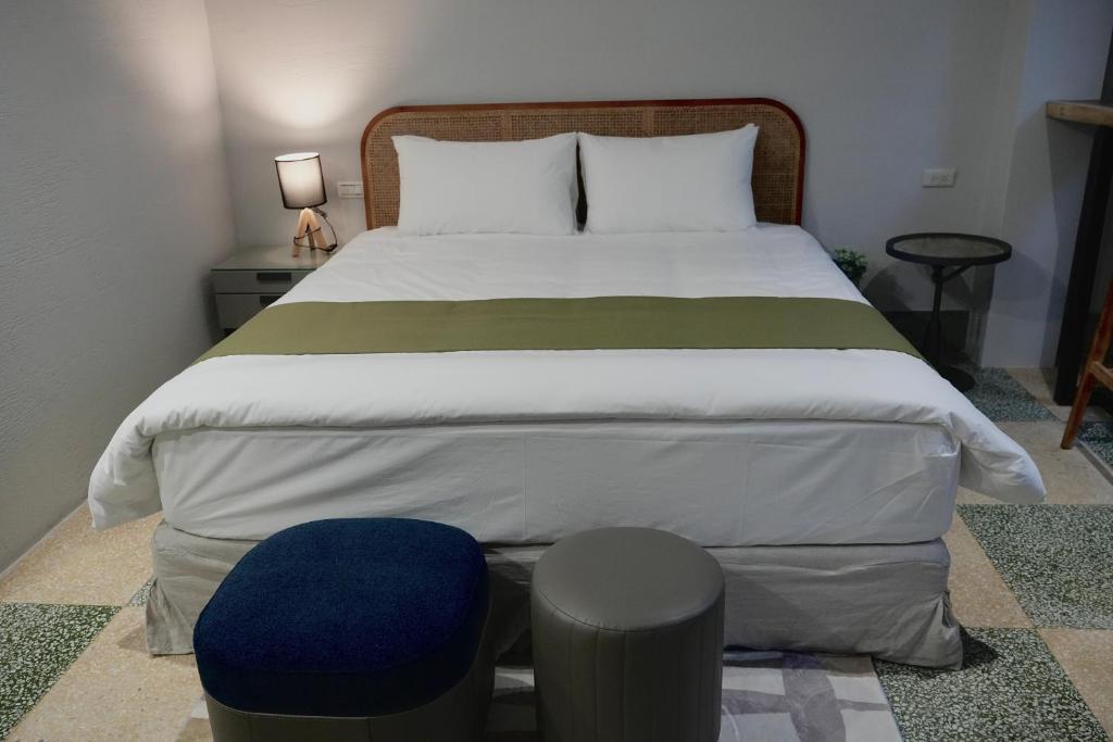 Postel nebo postele na pokoji v ubytování 璿 旅 Syuan Hotel