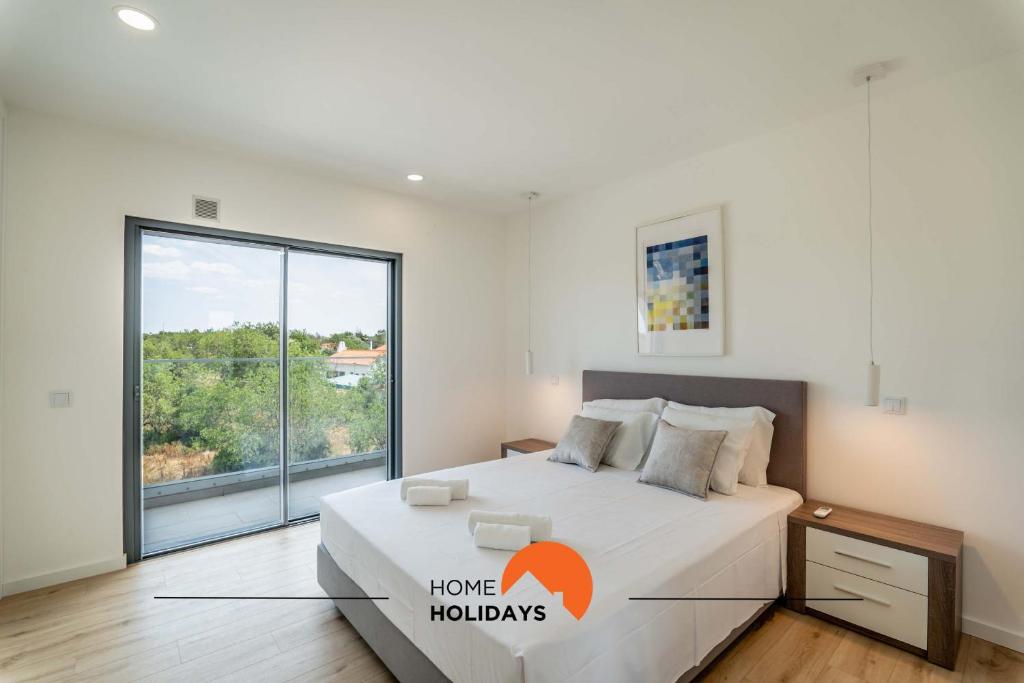 Katil atau katil-katil dalam bilik di #155 Lagoas Residence by Home Holidays
