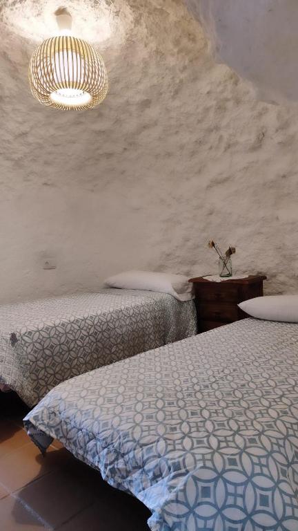 Posteľ alebo postele v izbe v ubytovaní Cueva Rural El Sendero