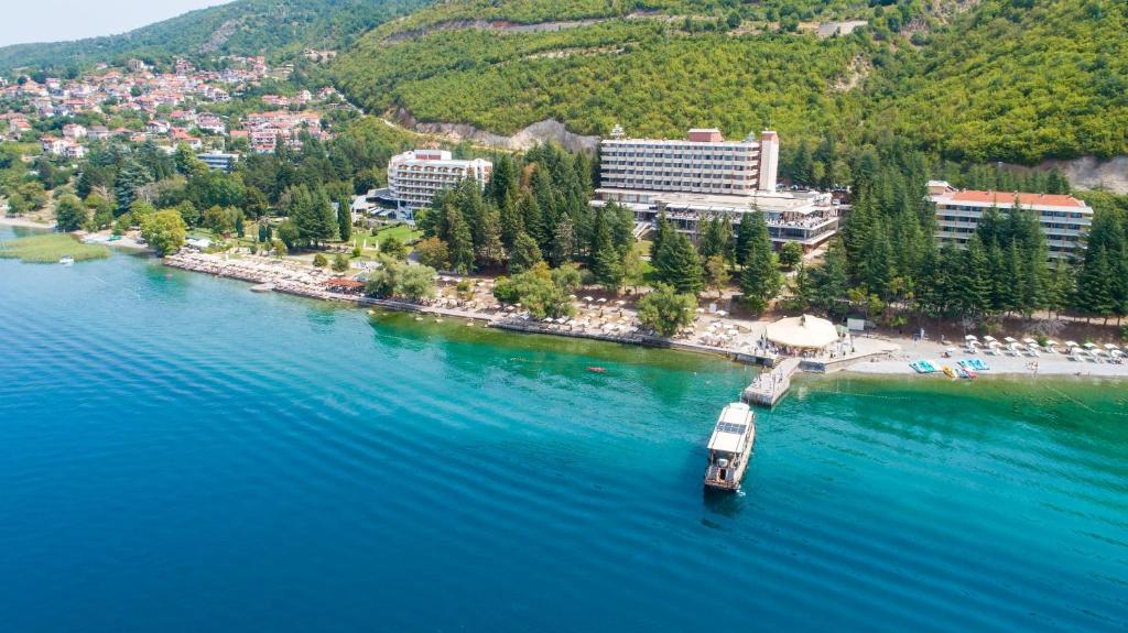a small island in the middle of a body of water at Hotel Metropol – Metropol Lake Resort in Ohrid
