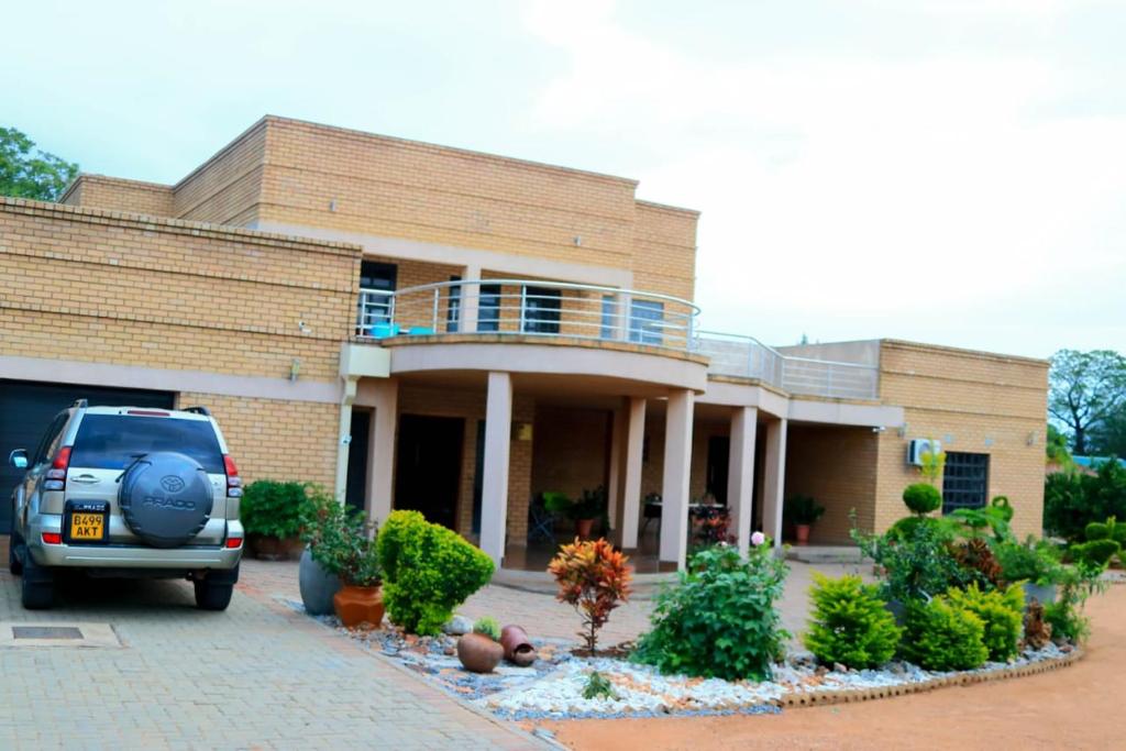 a car parked in front of a building at Mmathaba Guest House in Mmadinare
