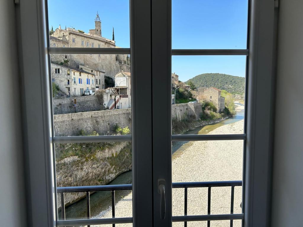 a view from a window of a town at Sur le Pont in Vaison-la-Romaine