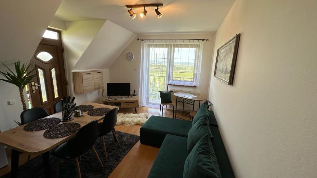 A television and/or entertainment centre at 2 room Apartment Nela, with a view of the mountains