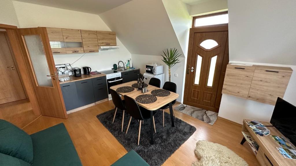A kitchen or kitchenette at 2 room Apartment Nela, with a view of the mountains
